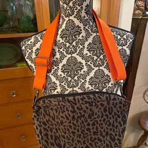 Panache brand crossbody, NWOT, animal print canvas, orange strap.